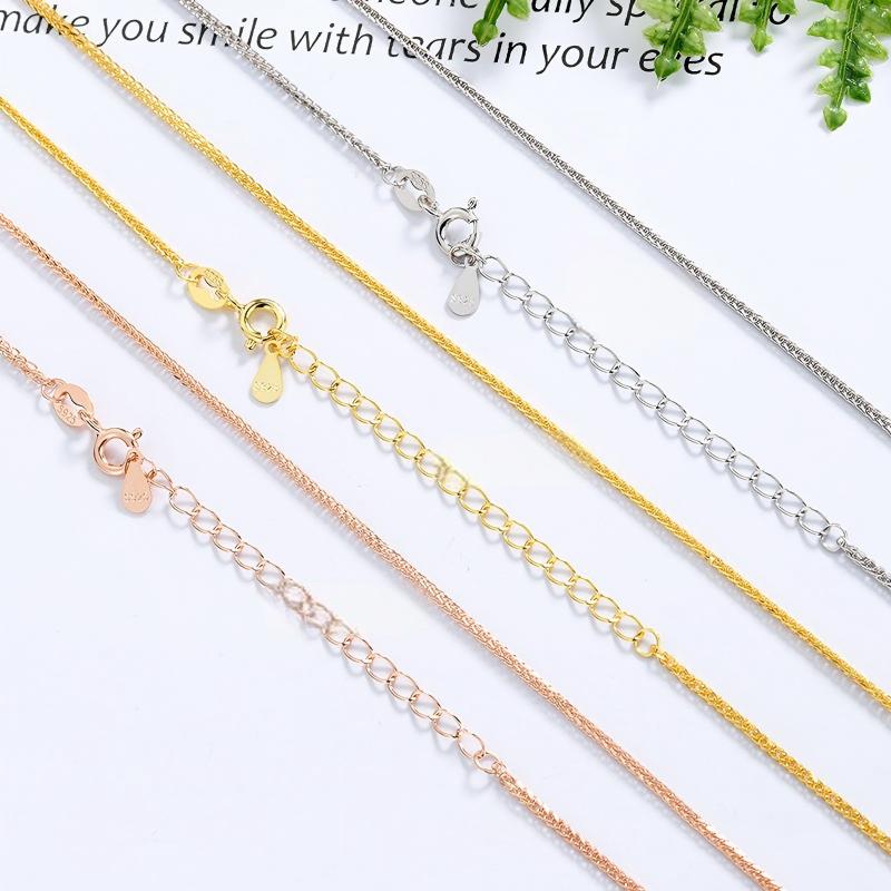 Silver chain on neutral background. Alt: “Chopin Chain in 925 Sterling Silver – Classic Link Necklace.”