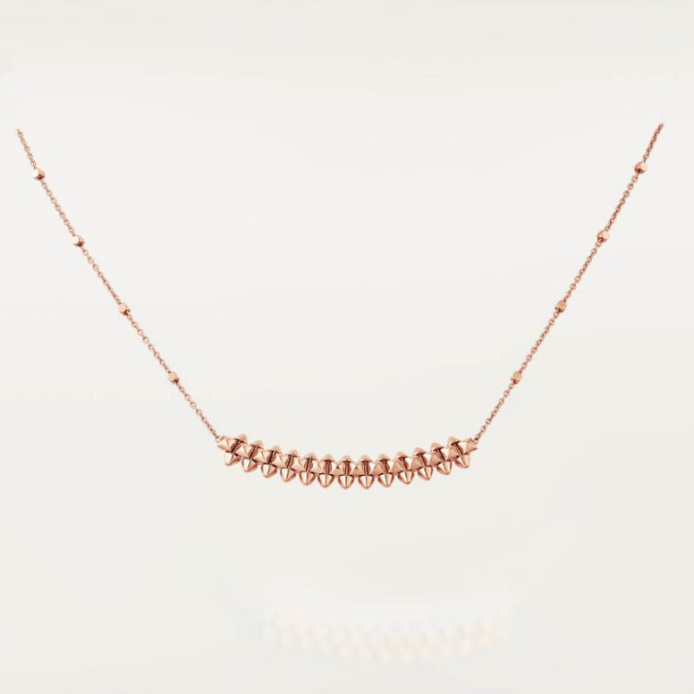 Clash de Cartier pendantRose gold necklace on a light gray background