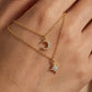 Macro, necklace draped across female hand, natural curve, warm soft light, mirror metal shine, sharp sparkle, blurred skin background, detailed texture, intimate luxury feel.