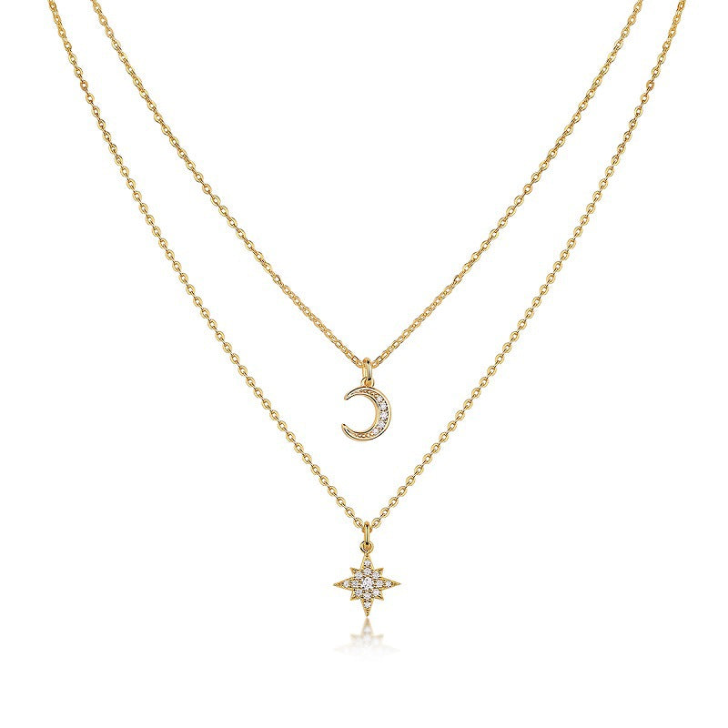 Clean white background — the crescent moon moissanite pendant and star pendant, each on its own chain, layered elegantly on a bust form. The moon catches light, showcasing sparkling moissanite accents; the star sits slightly lower or higher depending on chain lengths. Chains drape smoothly without tangling.