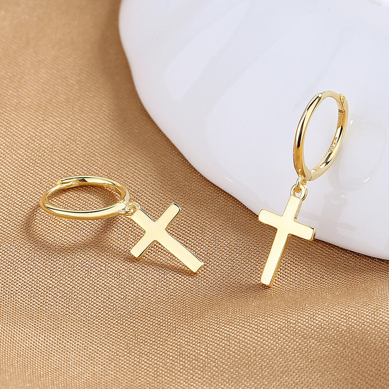 Gold cross hoop earrings on soft white background. Alt: “Gold Cross Hoop Earrings – Religious Symbol Jewelry.