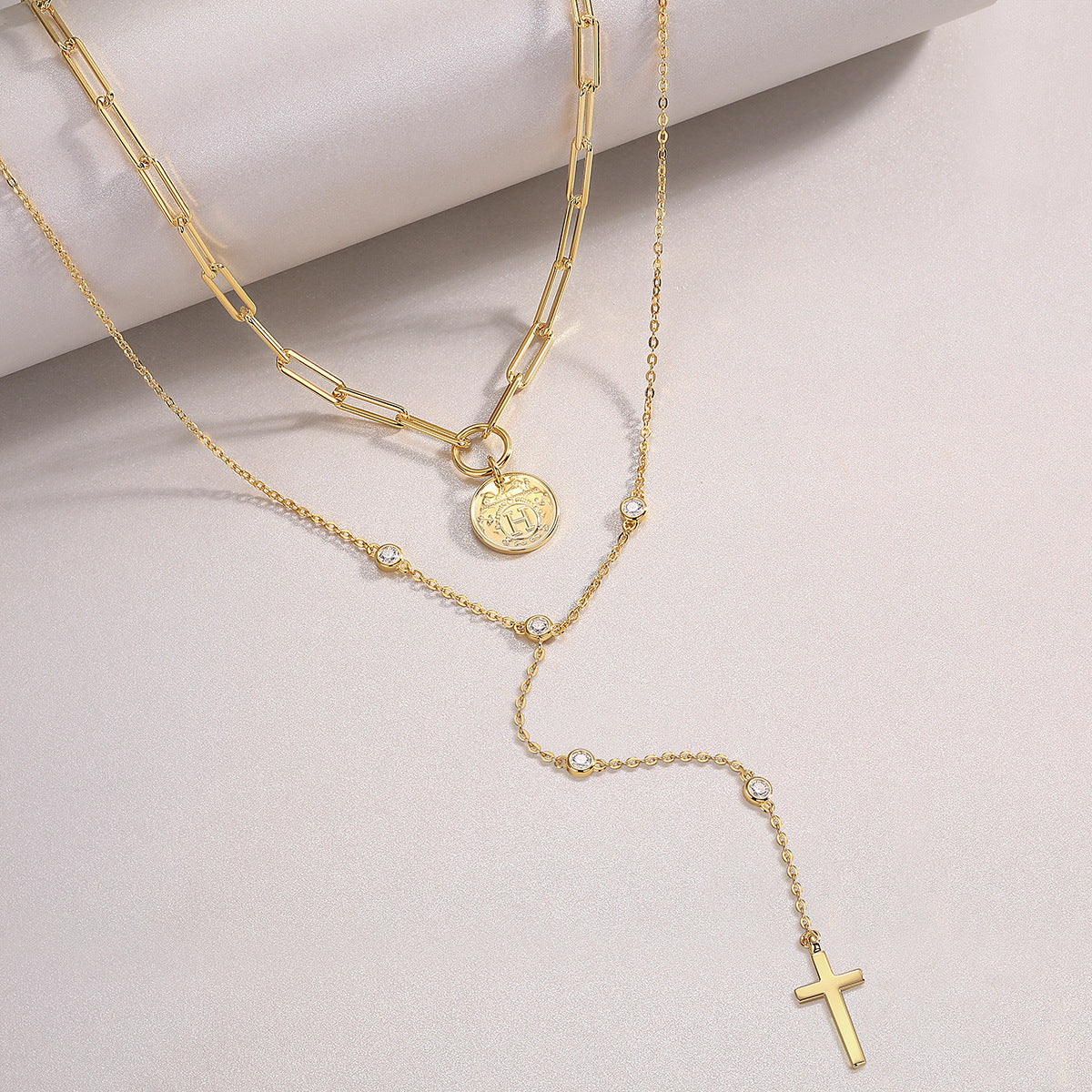Focus on the moissanite stone’s fire and the cross’s polished edges.