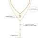 Clean white background – both necklaces layered naturally on a bust form. The moissanite cross catches light, showing brilliant sparkle; the medallion sits slightly below it, with visible faith engraving. Golden chains drape gracefully without tangling.