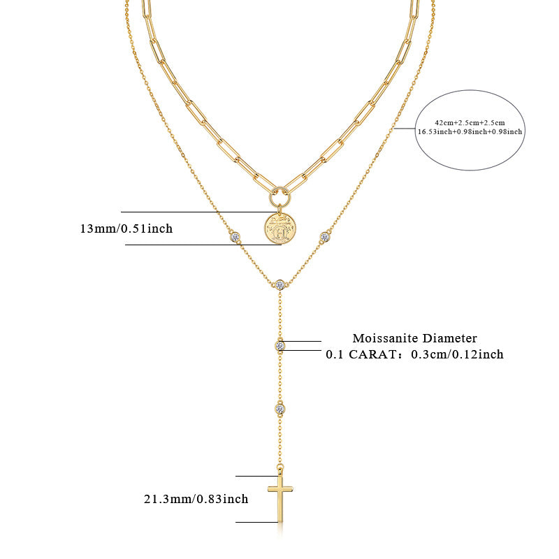 Clean white background – both necklaces layered naturally on a bust form. The moissanite cross catches light, showing brilliant sparkle; the medallion sits slightly below it, with visible faith engraving. Golden chains drape gracefully without tangling.