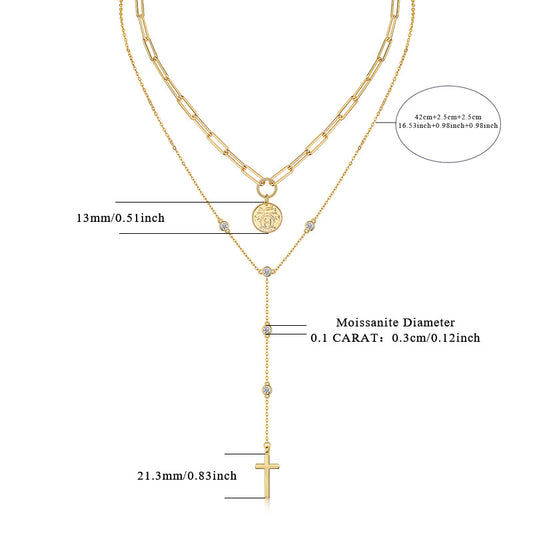 Clean white background – both necklaces layered naturally on a bust form. The moissanite cross catches light, showing brilliant sparkle; the medallion sits slightly below it, with visible faith engraving. Golden chains drape gracefully without tangling.