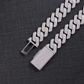 Silver chain belt with a clasp on a dark textured background