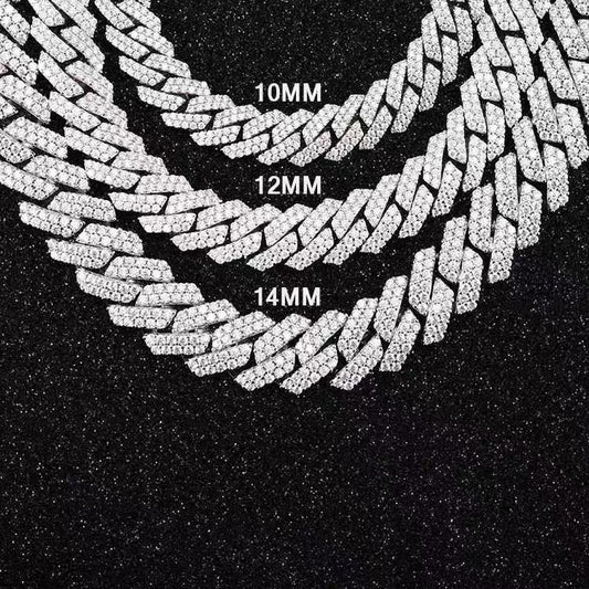 Three diamond-encrusted chains of different widths on a black background