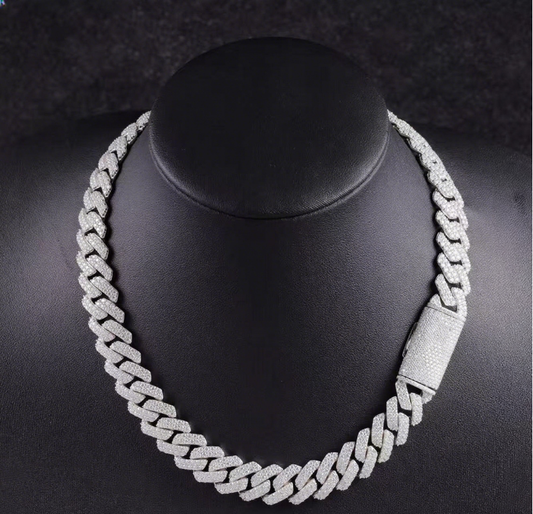 Silver chain necklace on a black mannequin bust