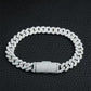 Silver chain bracelet on a black textured background