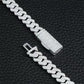 Silver braided chain bracelet on a black textured background