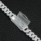 Silver chain bracelet with diamond-like crystals on a black textured background