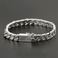 Silver chain bracelet on a dark background