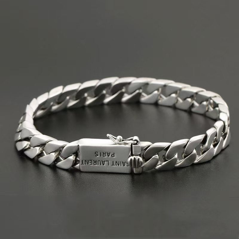 Silver chain bracelet on a dark background