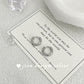 Silver hoop earrings on a card with text and 'joen design silver' branding.