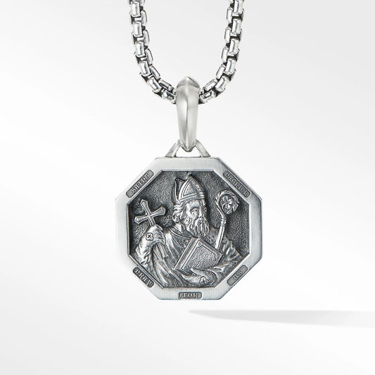 Silver pendant necklace with a detailed design on a white background