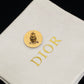 Dior Black CD Signature Stud Costume Jewelry Earrings on a branded Dior box