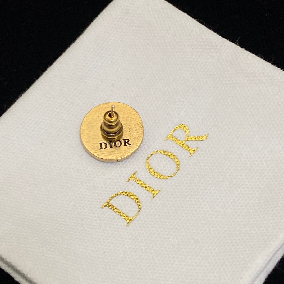 Dior Black CD Signature Stud Costume Jewelry Earrings on a branded Dior box