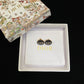 Dior Black CD Signature Stud Costume Jewelry Earringsn a branded box on a black background