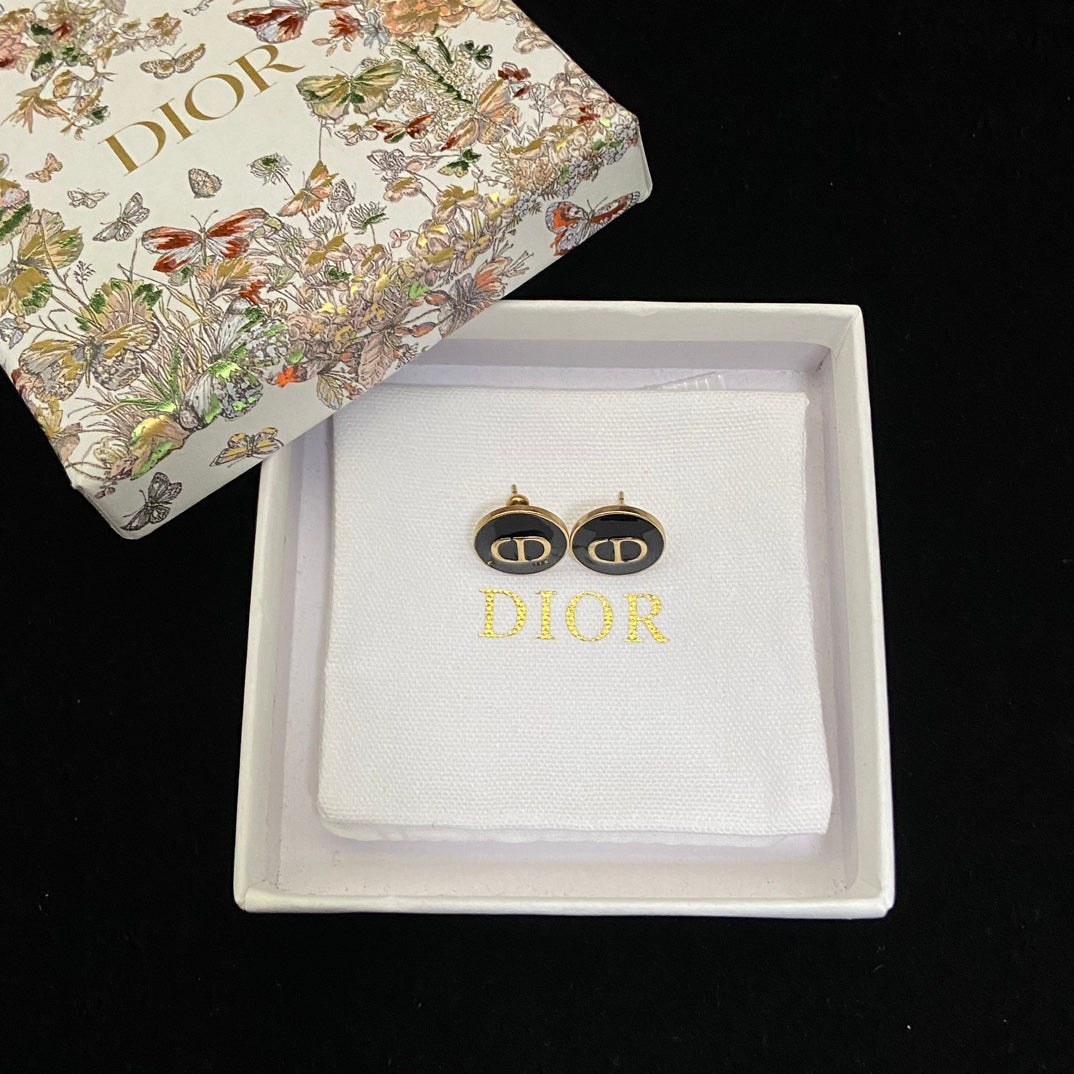 Dior Black CD Signature Stud Costume Jewelry Earringsn a branded box on a black background