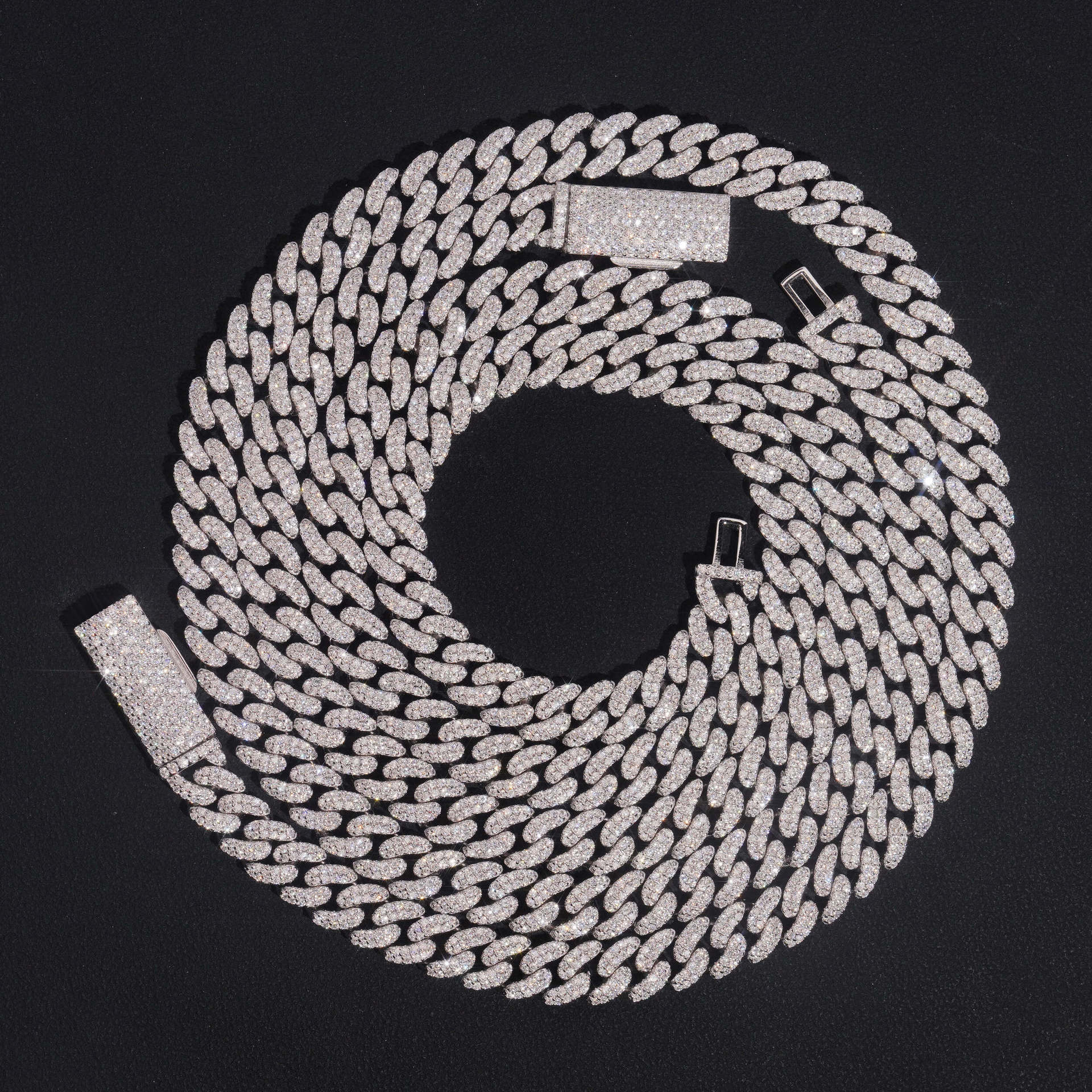 Clean black or dark background (to maximize sparkle contrast) — the double row iced out moissanite Cuban link chain displayed flat or on a bust form. Both rows of links are fully pavé with moissanite stones, creating a wider, more substantial band of continuous sparkle that catches bright light from every angle.