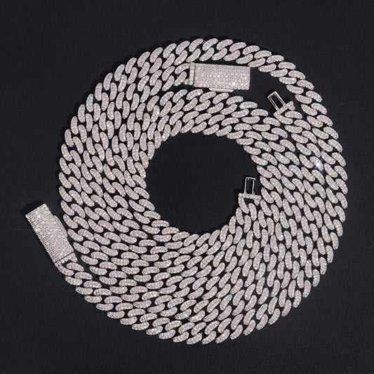 Clean black or dark background (to maximize sparkle contrast) — the double row iced out moissanite Cuban link chain displayed flat or on a bust form. Both rows of links are fully pavé with moissanite stones, creating a wider, more substantial band of continuous sparkle that catches bright light from every angle.