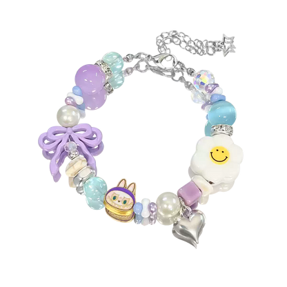 Colorful bracelet with various charms on a white background