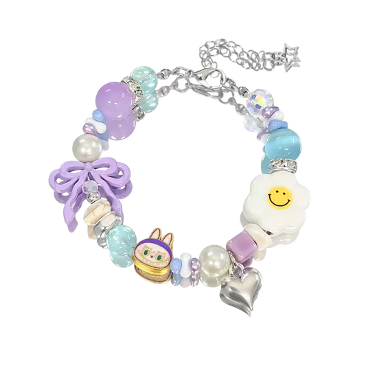 Colorful bracelet with various charms on a white background