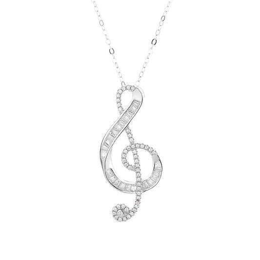 Silver treble clef necklace with diamonds on a white background
