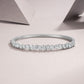 Diamond bracelet on a light pink background
