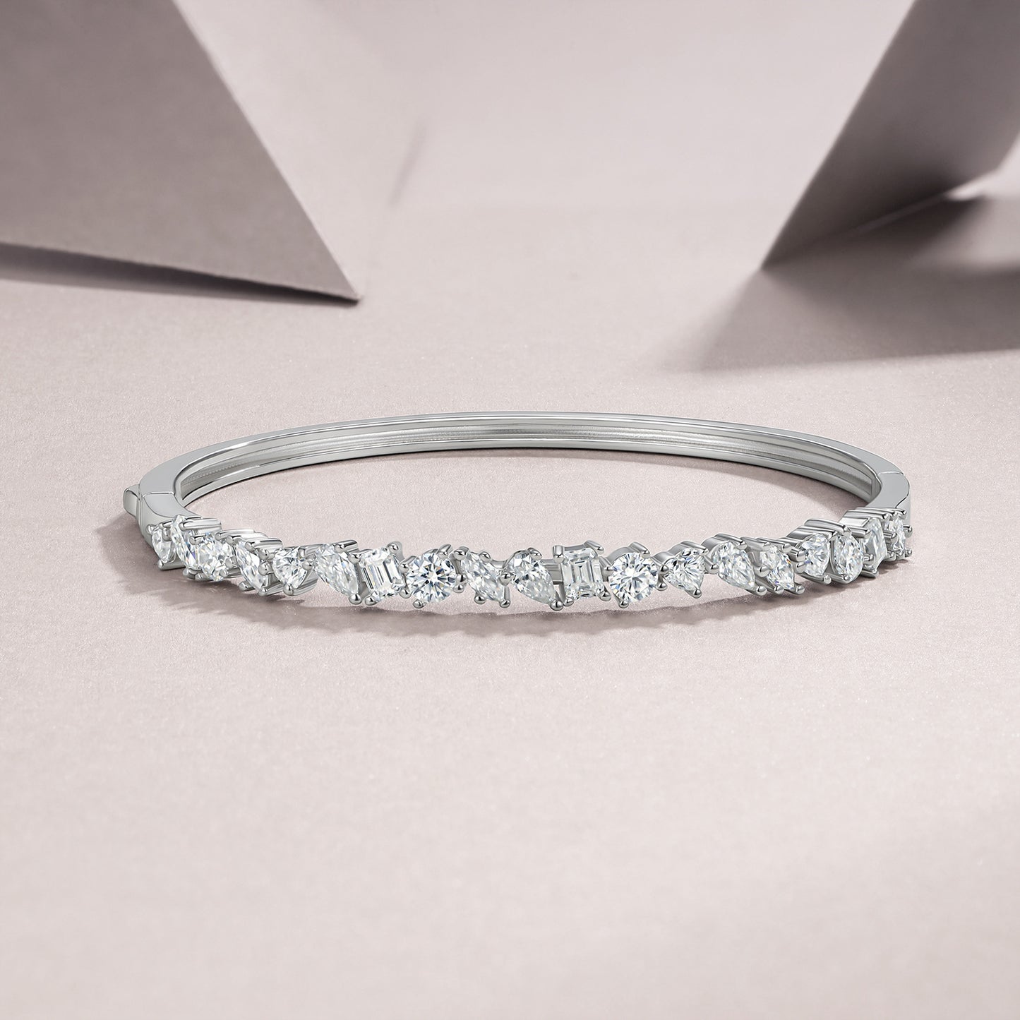 Diamond bracelet on a light pink background