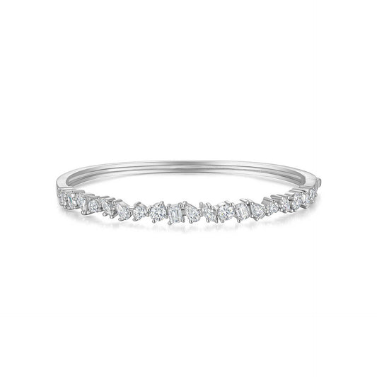 Delicate silver ring with small diamonds on a white background