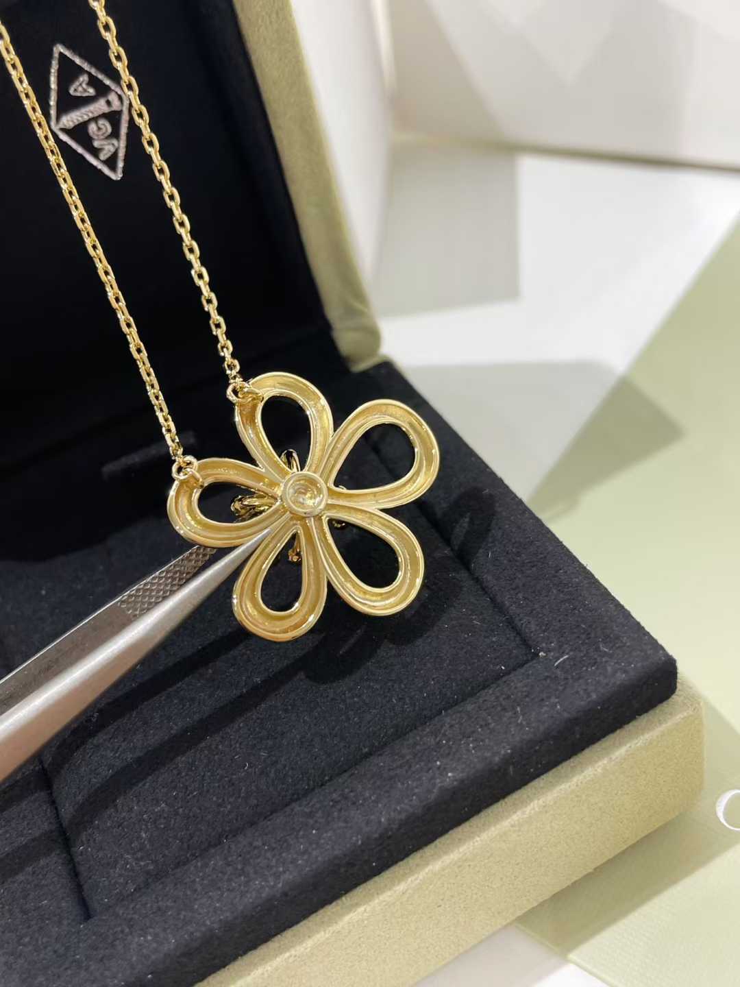 “Close-up of floral lace design cubic zirconia pendant”