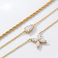 Macro, layered necklaces in 45° diagonal parallel layout, even spacing, mirror-polished gold, bright clean lighting, sharp stone brilliance, white textured background, soft shadow, ultra-detailed.