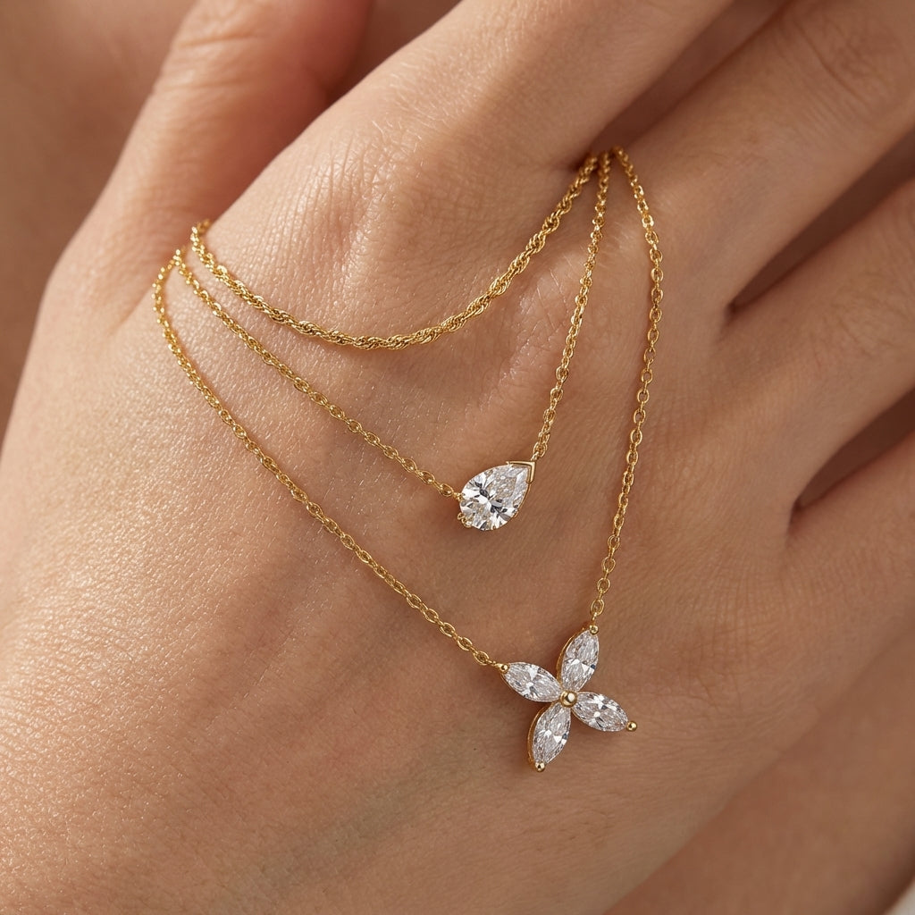 Macro, necklace draped across female hand, natural curve, warm soft light, mirror metal shine, sharp sparkle, blurred skin background, detailed texture, intimate luxury feel.