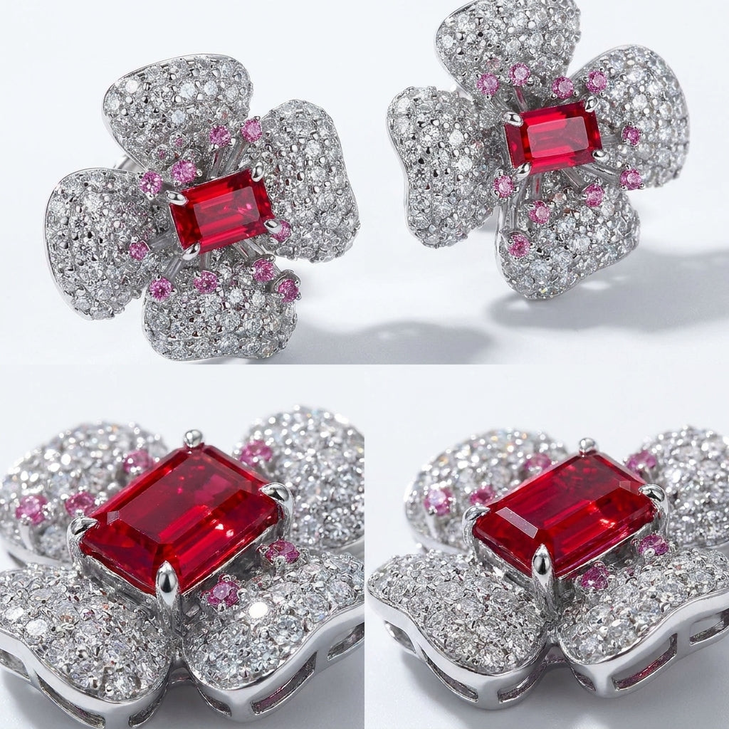 Floral earrings with red gemstones and pink accents on a white background