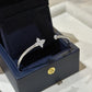 Silver bracelet with star design in a black jewelry box