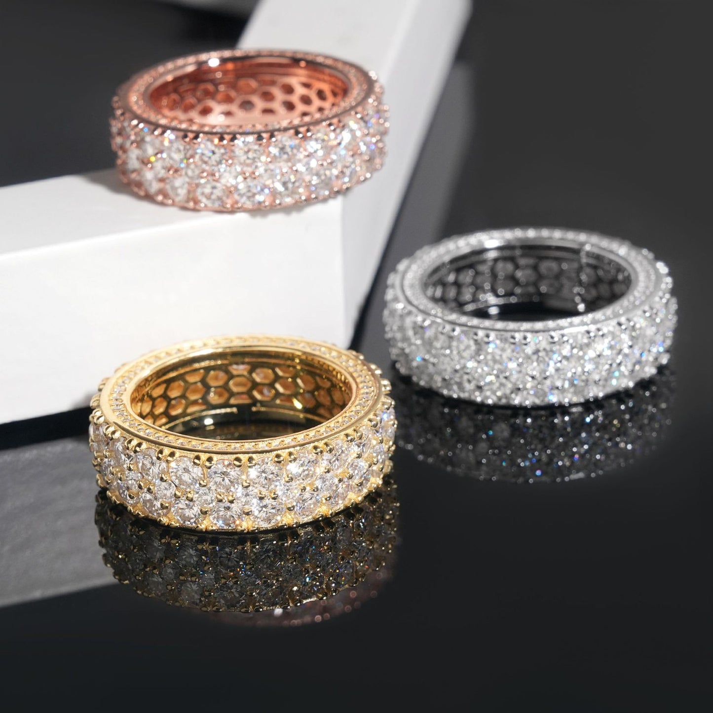 Gold eternity band on dark background, showing continuous pavé sparkle. Alt: “Full-Pavé Moissanite Eternity Ring – 18K Gold Unisex.”