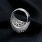 White gold cluster ring on dark background, showing full ice sparkle. Alt: “Full Iced Out Rapper Cluster Halo Ring – 18K White Gold.”