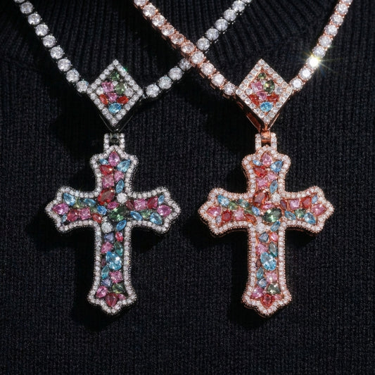 Two colorful cross pendants on a black background