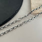 “Gucci 3 interlocking GG stations silver necklace flat lay”