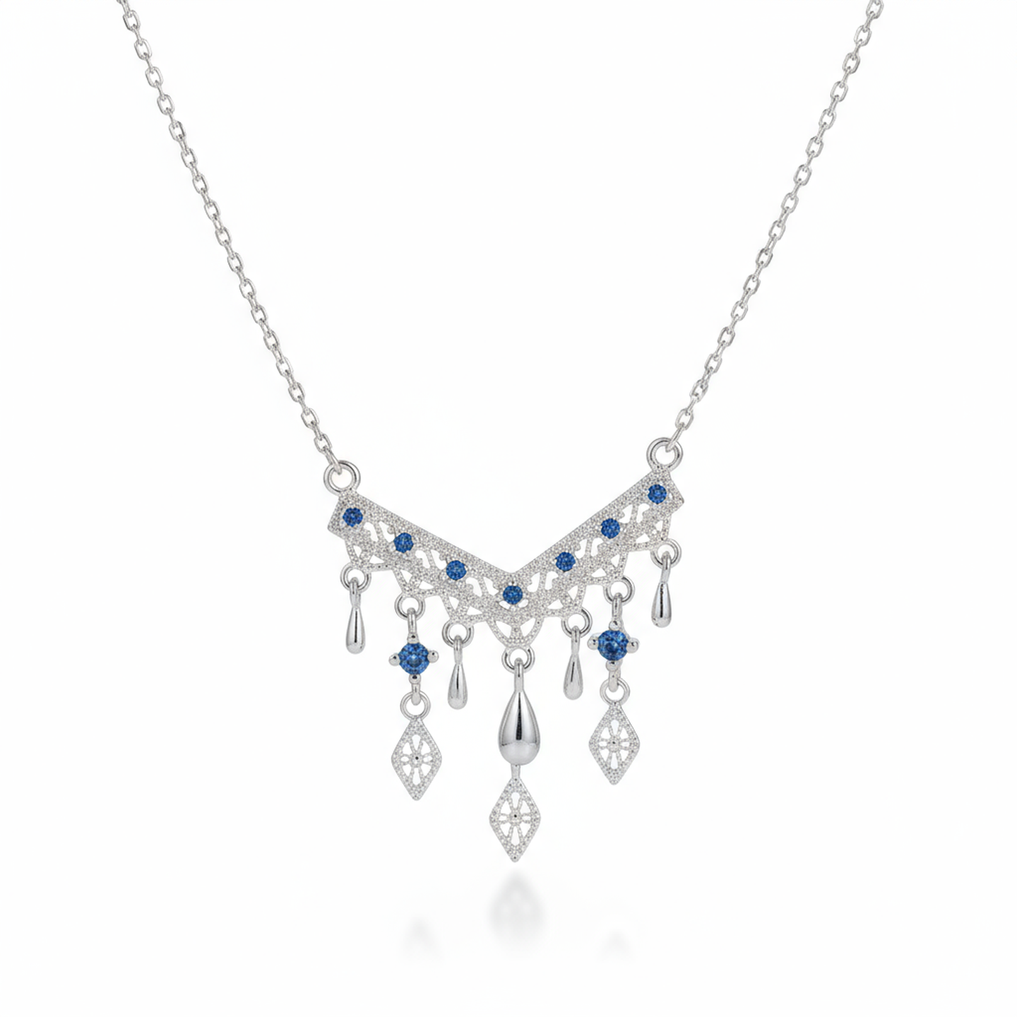 Silver necklace with blue gemstones on a white background