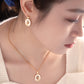 Close-up of a person wearing gold earrings and necklace with 'Shanjin Light Luxury' branding.