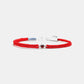 Red braided bracelet with a silver clasp on a white background