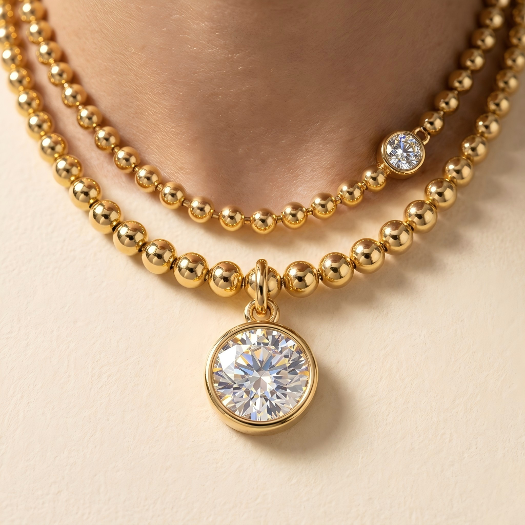 Straight-on to clearly showcase the 8.5MM gold ball beads and the two different chain lengths.