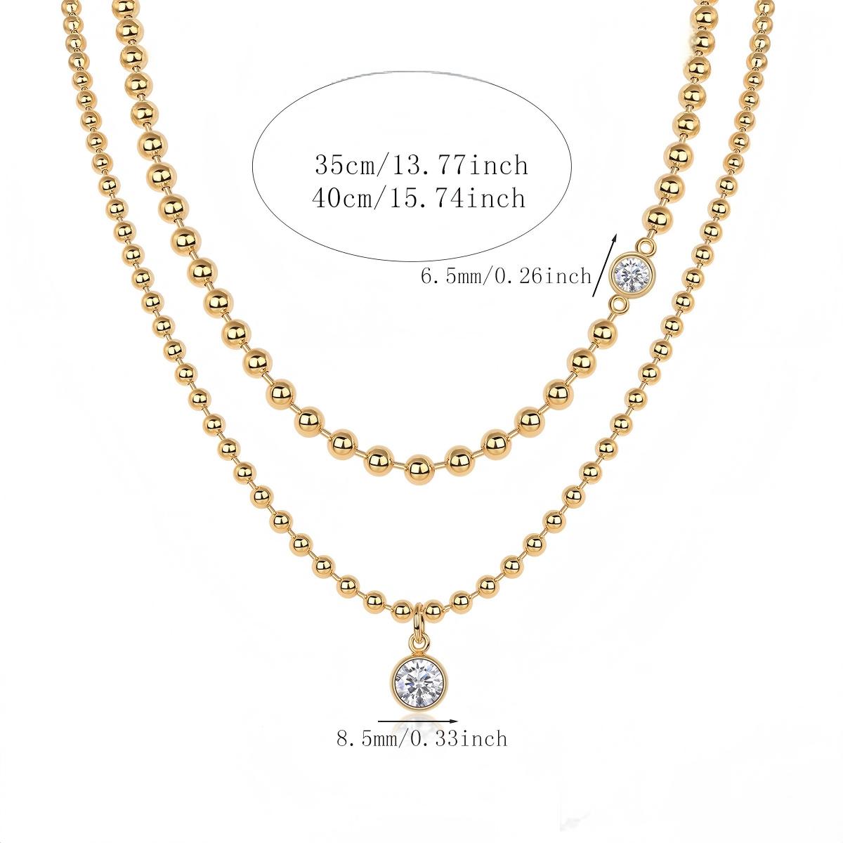 High-definition shot of both necklaces laid flat together on pure white background, arranged to show the layered effect.