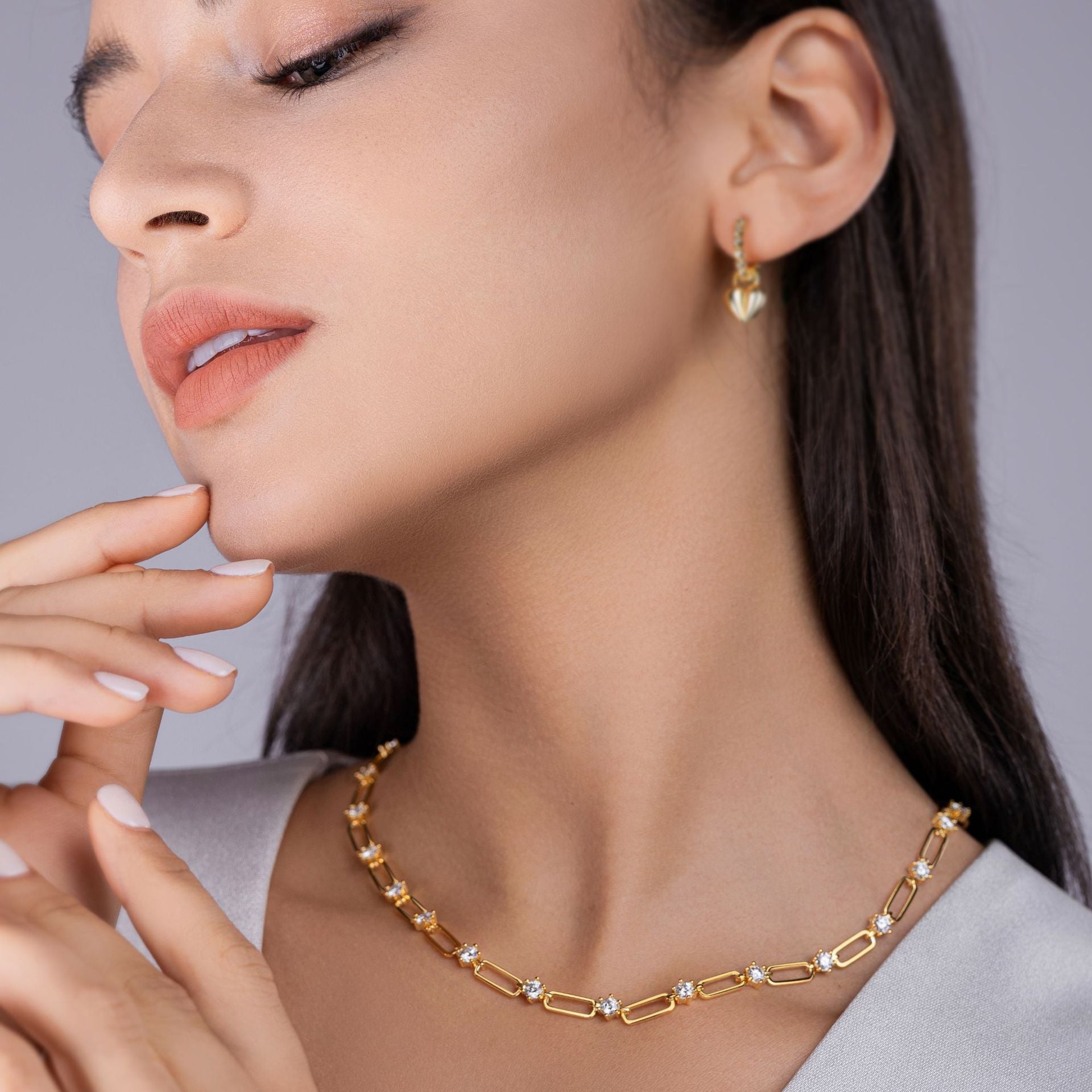 Model wearing the necklace alone on bare skin.