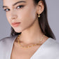 Model wearing the necklace alone on bare skin.