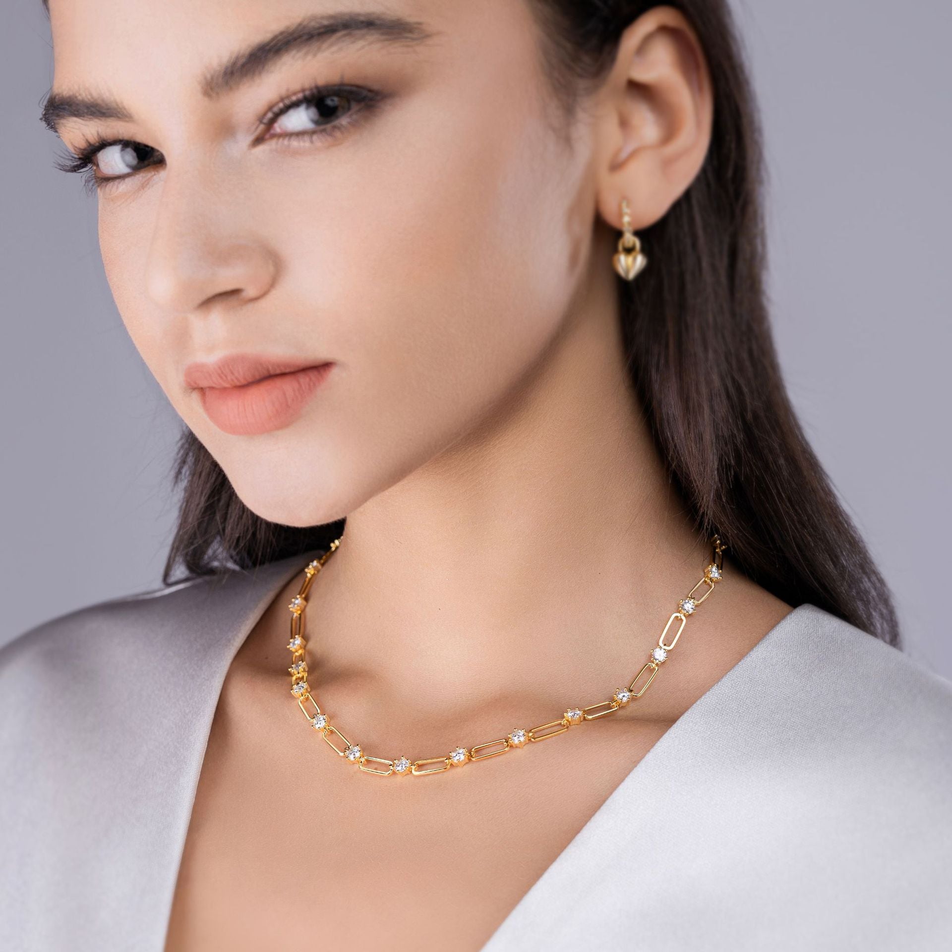 Model wearing the necklace alone on bare skin.