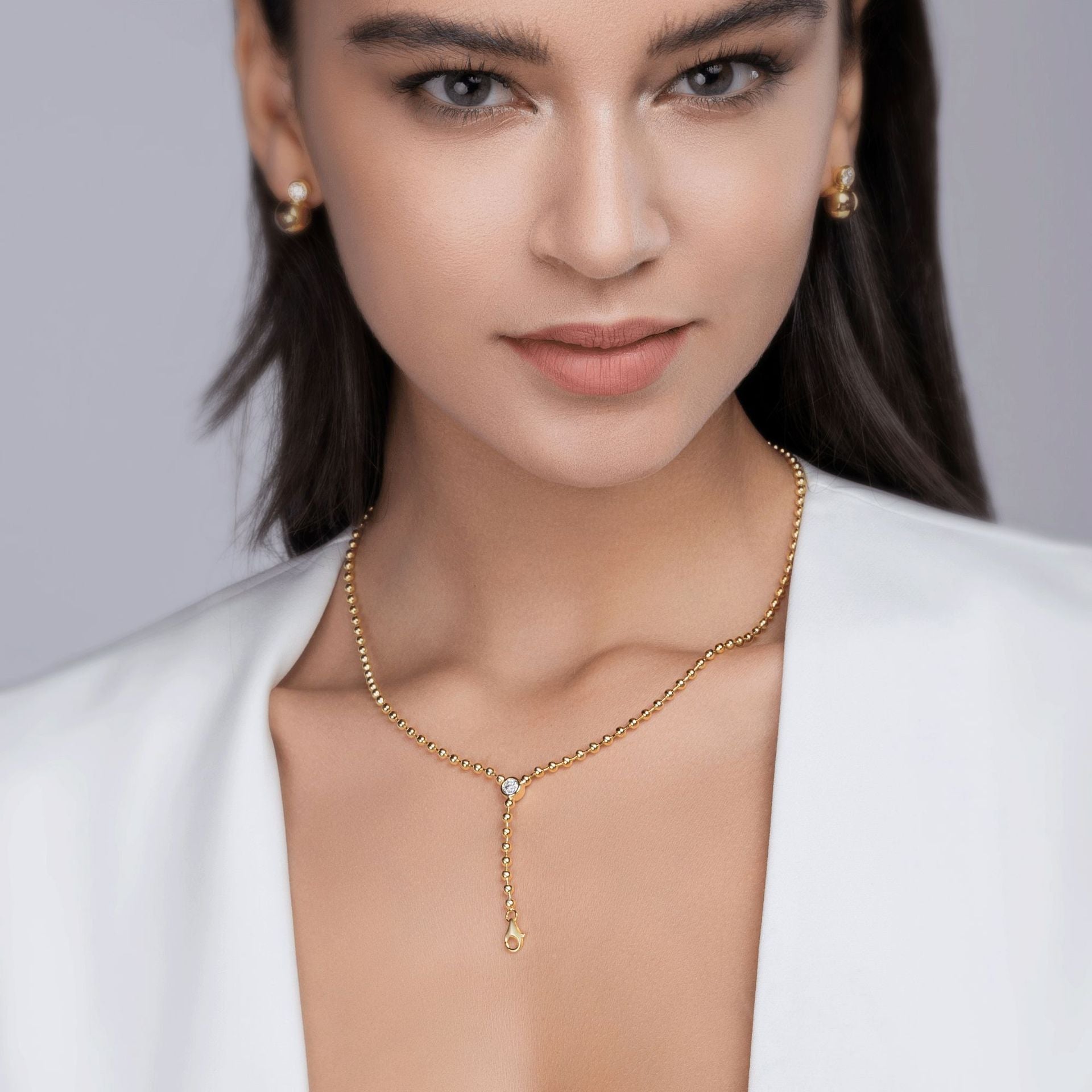 Model wearing the necklace alone on bare skin.