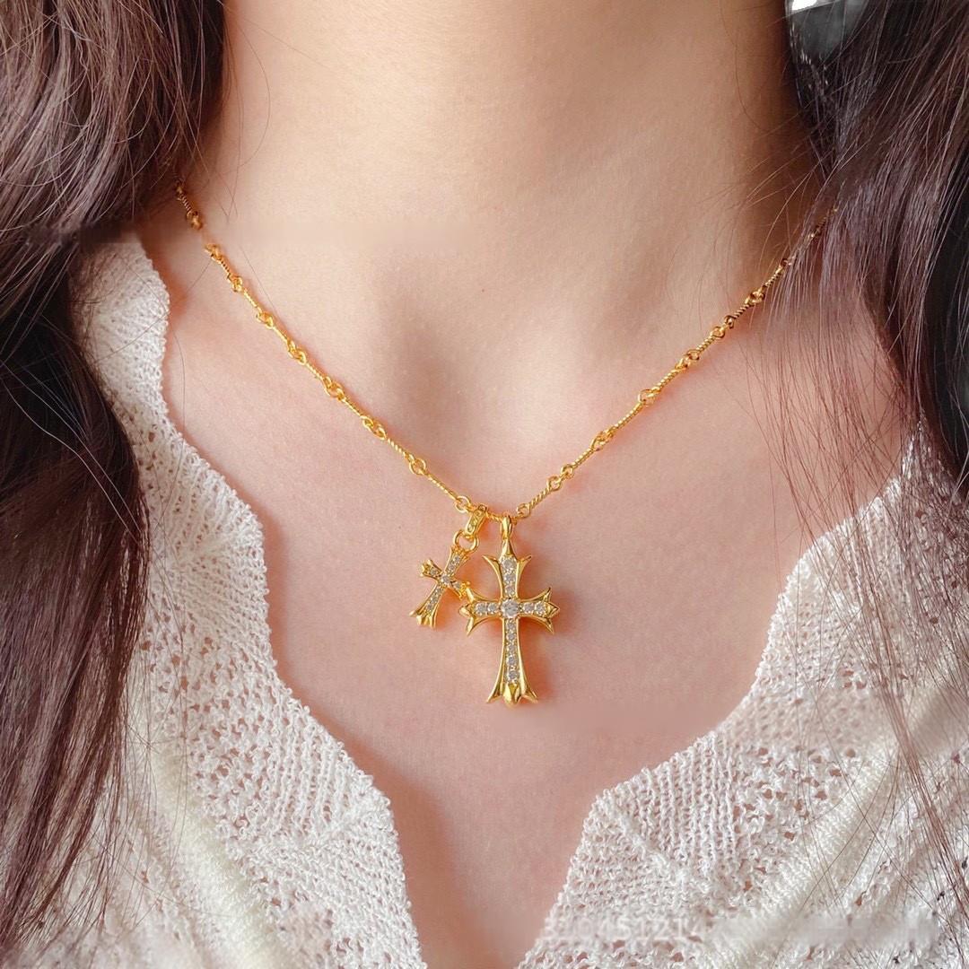 “Female model wearing gold and silver double cross necklace choker style”